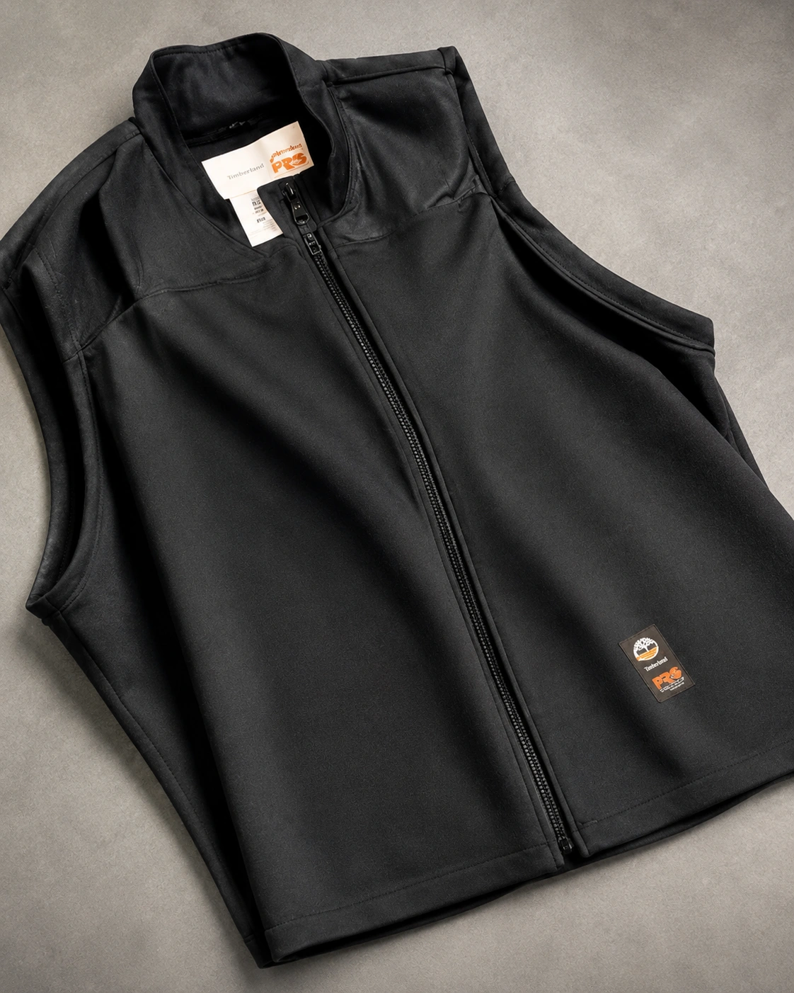 Dark vest product on a clean background
